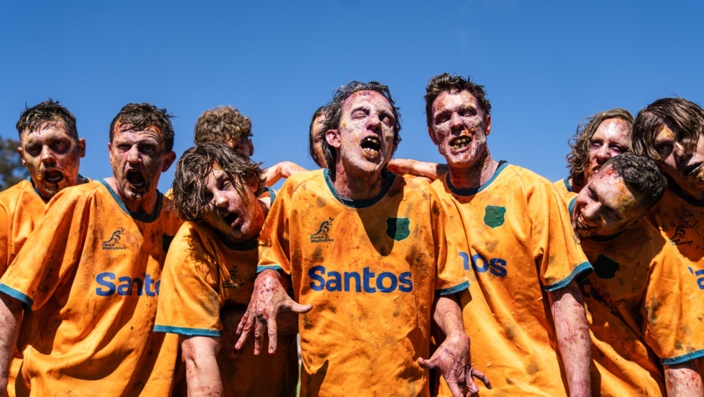 Zombie rugby players wearing Santos logos